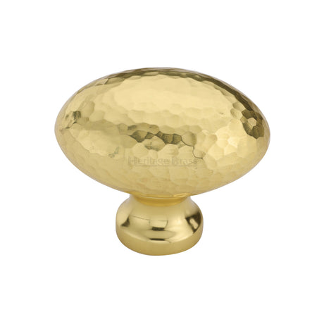 This is an image of a Heritage Brass - Cabinet Knob Victorian Oval Hammered Design 38mm Polished Brass finish, ham114-38-pb that is available to order from Trade Door Handles in Kendal.