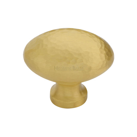 This is an image of a Heritage Brass - Cabinet Knob Victorian Oval Hammered Design 38mm Satin Brass finish, ham114-38-sb that is available to order from Trade Door Handles in Kendal.