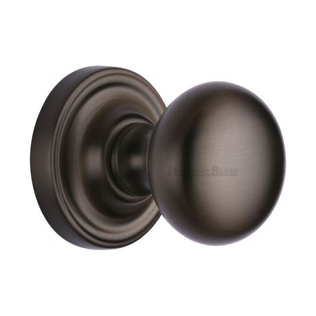 This is an image of a Heritage Brass - Mortice Knob on Rose Hampstead Design Matt Bronze Finish, ham8361-mb that is available to order from Trade Door Handles in Kendal.