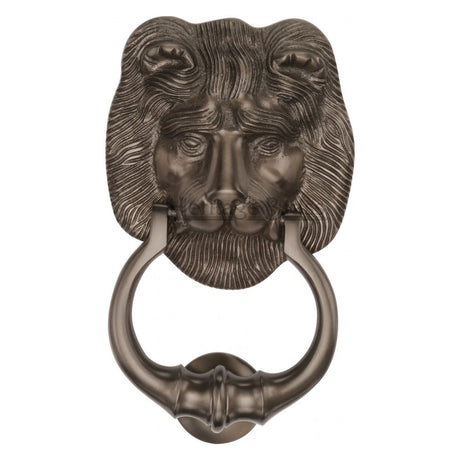 This is an image of a Heritage Brass - Lion Knocker Matt Bronze Finish, k1210-mb that is available to order from Trade Door Handles in Kendal.