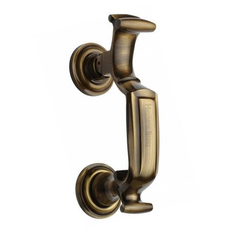This is an image of a Heritage Brass - Doctor Knocker Antique Brass Finish, k1300-at that is available to order from Trade Door Handles in Kendal.