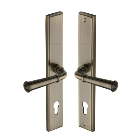 This is an image of a Heritage Brass - Multi-Point Door Handle Lever Lock Colonial LH Design Antique Bras, mp1932-lh-at that is available to order from Trade Door Handles in Kendal.