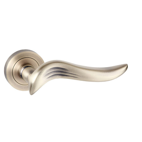 This is an image of Old English Oxford Lever on Round Rose - Matt Antique Brass available to order from Trade Door Handles