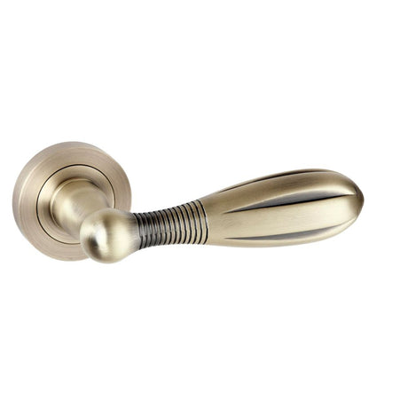 This is an image of Old English Cambridge Lever on Round Rose - Matt Antique Brass available to order from Trade Door Handles