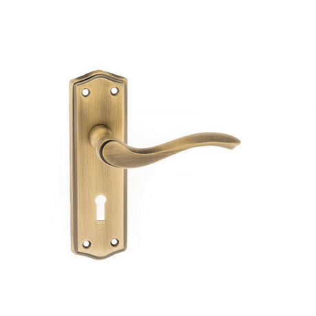 This is an image of Old English Warwick Key Lever on Backplate - Matt Antique Brass available to order from Trade Door Handles.