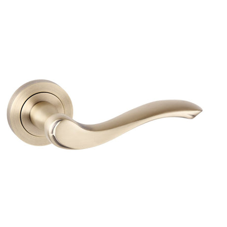 This is an image of Old English Warwick Lever on Round Rose - Matt Antique Brass available to order from Trade Door Handles.