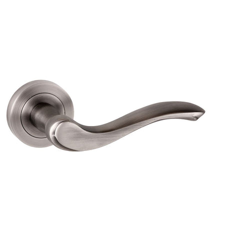 This is an image of Old English Warwick Lever on Round Rose - Matt Gun Metal available to order from Trade Door Handles.
