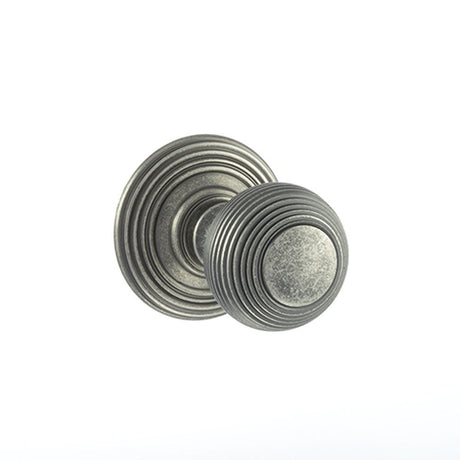 This is an image of Old English Ripon Solid Brass Reeded Mortice Knob on Concealed Fix Rose - Distre available to order from Trade Door Handles.