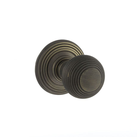 This is an image of Old English Ripon Solid Brass Reeded Mortice Knob on Concealed Fix Rose - Urban available to order from Trade Door Handles.