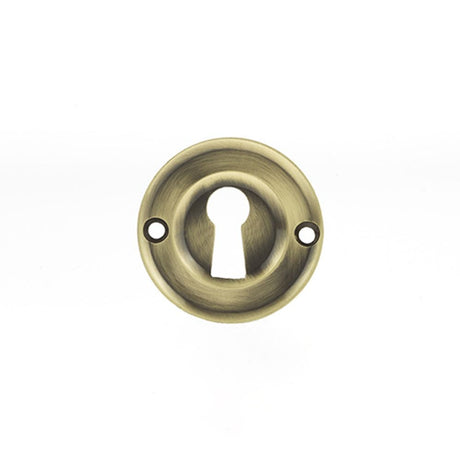This is an image of Old English Solid Brass Open Key Hole Escutcheon - Antique Brass available to order from Trade Door Handles