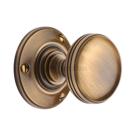 This is an image of a Heritage Brass - Mortice Knob on Rose Richmond Design Antique Brass Finish, rhm988-at that is available to order from Trade Door Handles in Kendal.