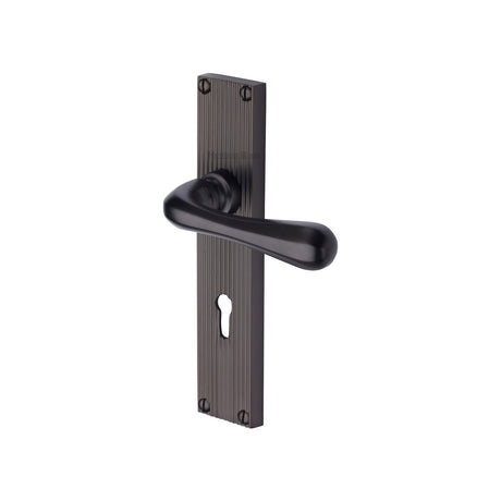 This is an image of a Heritage Brass - Charlbury Reeded Lever Lock Matt Bronze finish, rr3000-mb that is available to order from Trade Door Handles in Kendal.