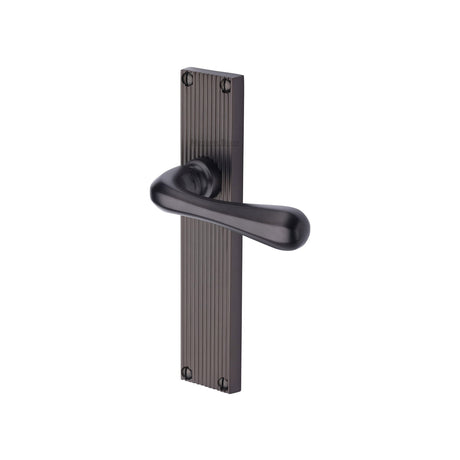 This is an image of a Heritage Brass - Charlbury Reeded Lever Latch Matt Bronze finish, rr3010-mb that is available to order from Trade Door Handles in Kendal.