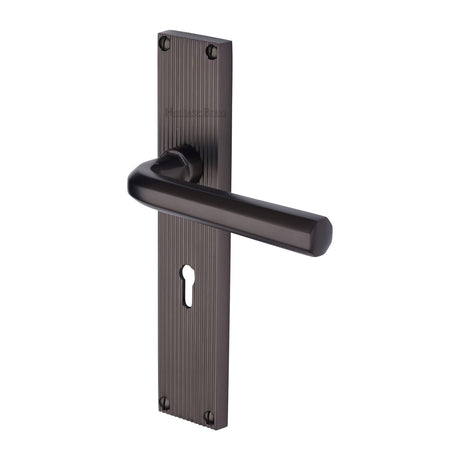 This is an image of a Heritage Brass - Octave Reeded Lever Lock Matt Bronze finish, rr3700-mb that is available to order from Trade Door Handles in Kendal.