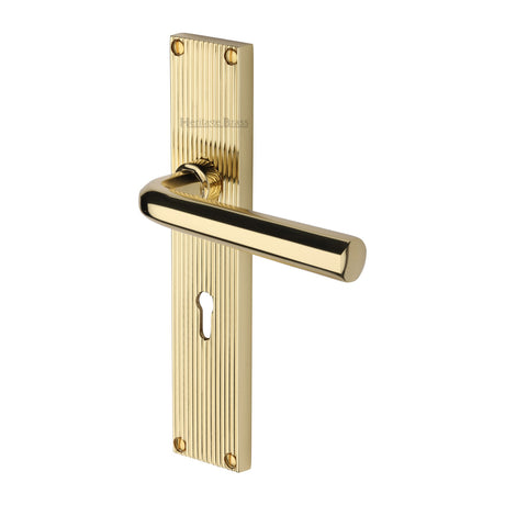 This is an image of a Heritage Brass - Octave Reeded Lever Lock Polished Brass finish, rr3700-pb that is available to order from Trade Door Handles in Kendal.