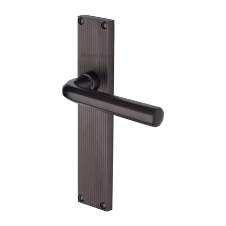 This is an image of a Heritage Brass - Octave Reeded Lever Latch Matt Bronze finish, rr3710-mb that is available to order from Trade Door Handles in Kendal.