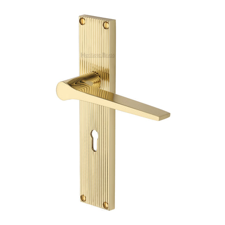 This is an image of a Heritage Brass - Gio Reeded Lever Lock Polished Brass finish, rr4700-pb that is available to order from Trade Door Handles in Kendal.