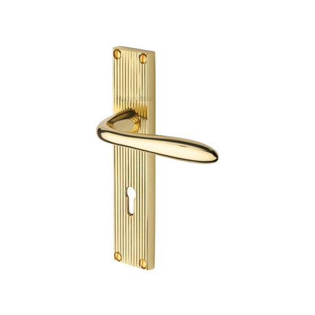 This is an image of a Heritage Brass - Sutton Reeded Lever Lock Polished Brass finish, rr5000-pb that is available to order from Trade Door Handles in Kendal.