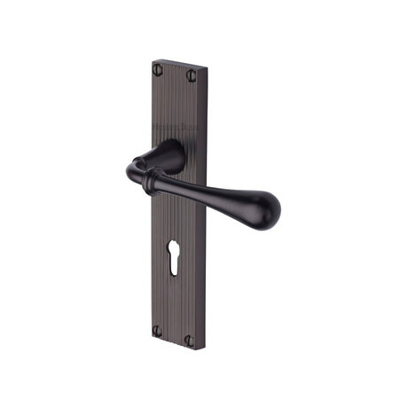 This is an image of a Heritage Brass - Roma Reeded Lever Lock Matt Bronze finish, rr6000-mb that is available to order from Trade Door Handles in Kendal.
