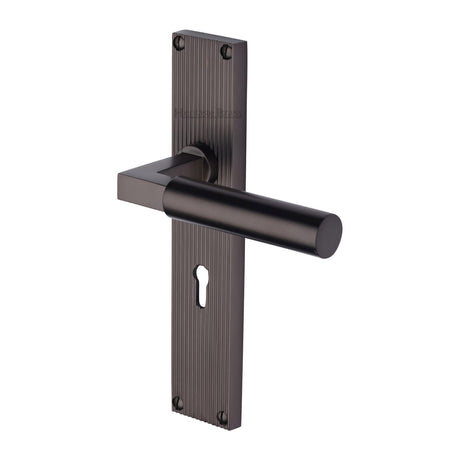 This is an image of a Heritage Brass - Bauhaus Reeded Lever Lock Matt Bronze finish, rr7300-mb that is available to order from Trade Door Handles in Kendal.