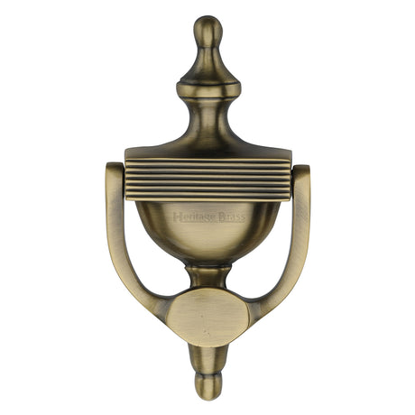 This is an image of a Heritage Brass - Urn Knocker 7 1/4" Antique Brass finish, rr912-195-at that is available to order from Trade Door Handles in Kendal.