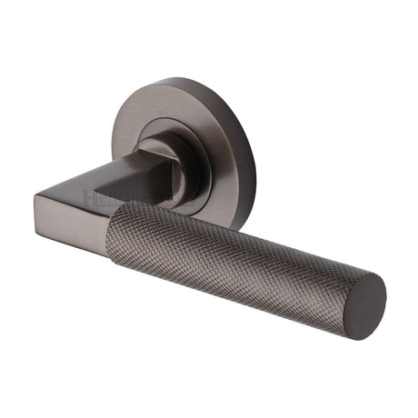 This is an image of a Heritage Brass - Door Handle Lever on Rose Signac (Knurled Bauhaus) Design Matt, rs2260-mb that is available to order from Trade Door Handles in Kendal.