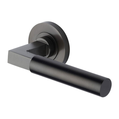 This is an image of a Heritage Brass - Door Handle Lever on Rose Spectral Design Matt Bronze Finish, rs2261-mb that is available to order from Trade Door Handles in Kendal.