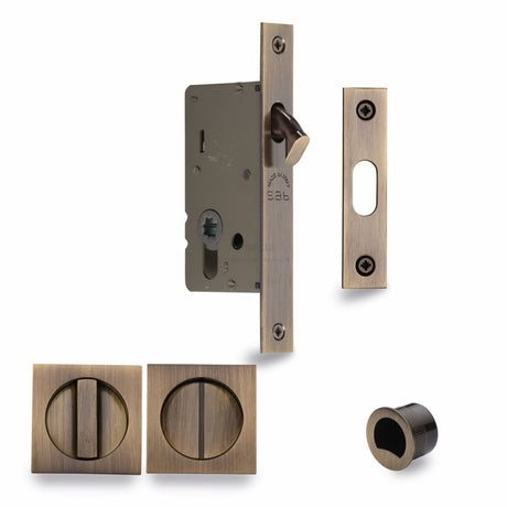 This is an image of a M.Marcus - SLD Lock C/W SQ Privacy Turns 40mm Antique Brass, sq2308-40-at that is available to order from Trade Door Handles in Kendal.