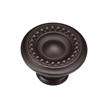 This is an image of a M.Marcus - Beaded Round Knob 035mm Matt Bronze Finish, tk4404-035-lbn that is available to order from Trade Door Handles in Kendal.