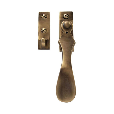 This is an image of a Heritage Brass - Casement Window Fastener Wedge Pattern Antique Brass Finish, v1005-at that is available to order from Trade Door Handles in Kendal.