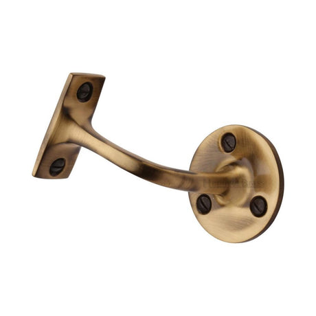 This is an image of a Heritage Brass - Handrail Bracket 2 1/2" Antique Brass Finish, v1030-64-at that is available to order from Trade Door Handles in Kendal.