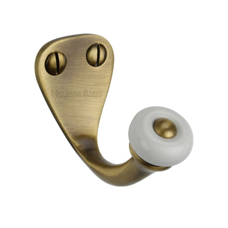 This is an image of a Heritage Brass - Single Robe Hook Antique Brass Finish, v1044-at that is available to order from Trade Door Handles in Kendal.