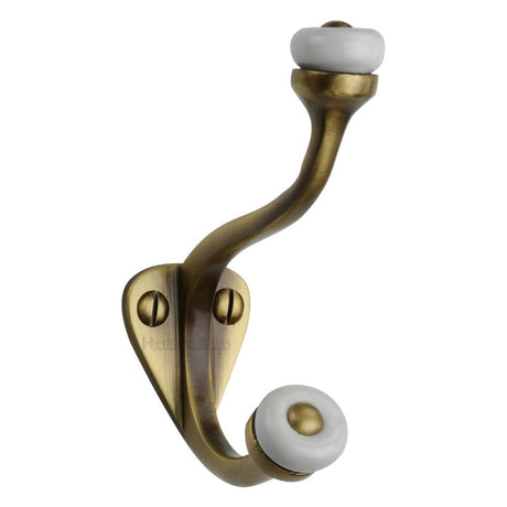 This is an image of a Heritage Brass - Hat & Coat Hook Antique Brass Finish, v1048-at that is available to order from Trade Door Handles in Kendal.