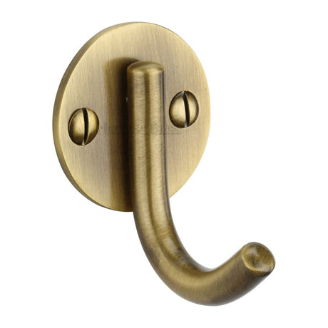 This is an image of a Heritage Brass - Single Robe Hook Antique Brass Finish, v1064-at that is available to order from Trade Door Handles in Kendal.