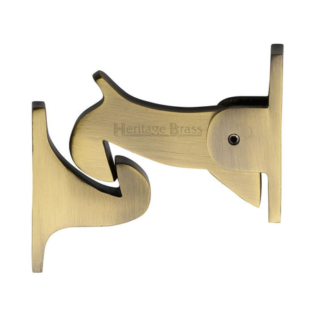 This is an image of a Heritage Brass - Door Holder Gravity Design Antique Brass Finish, v1074-at that is available to order from Trade Door Handles in Kendal.