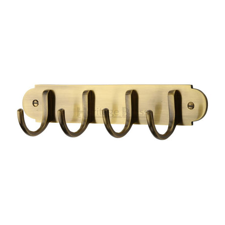 This is an image of a Heritage Brass - Coat Hooks on Plate Antique Brass Finish, v1079-at that is available to order from Trade Door Handles in Kendal.