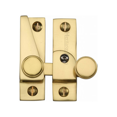 This is an image of a Heritage Brass - Sash Fastener Lockable Polished Brass Finish, v1106l-pb that is available to order from Trade Door Handles in Kendal.