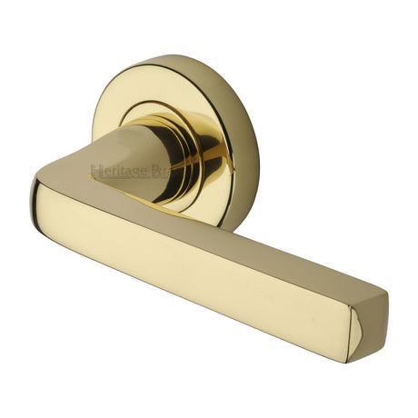 This is an image of a Heritage Brass - Alessa Door Handle on Round Rose Polished Brass finish, v8300-pb that is available to order from Trade Door Handles in Kendal.