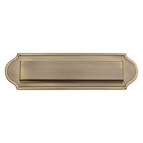 This is an image of a Heritage Brass - Gravity 11" Letterplate Antique Brass finish, v843-at that is available to order from Trade Door Handles in Kendal.