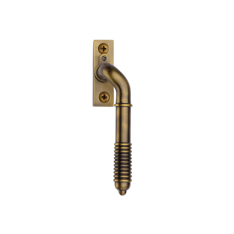This is an image of a Heritage Brass - Lockable Reeded Espagnolette Right Handed Antique Brass Finish, v895l-rh-at that is available to order from Trade Door Handles in Kendal.