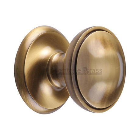 This is an image of a Heritage Brass - Round Centre Door Knob 3" Antique Brass Finish, v900-at that is available to order from Trade Door Handles in Kendal.