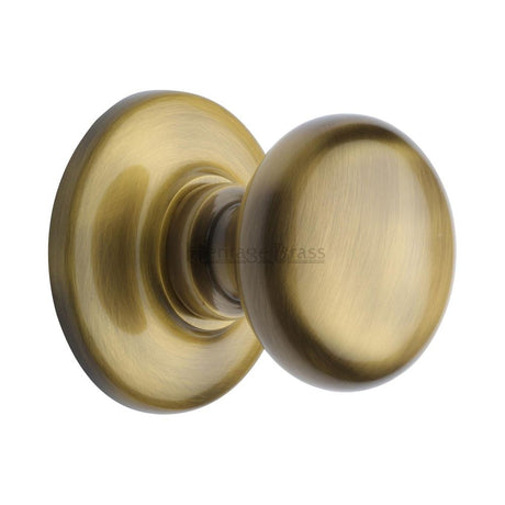 This is an image of a Heritage Brass - Centre Door Knob Round Design 3" Antique Brass Finish, v901-at that is available to order from Trade Door Handles in Kendal.