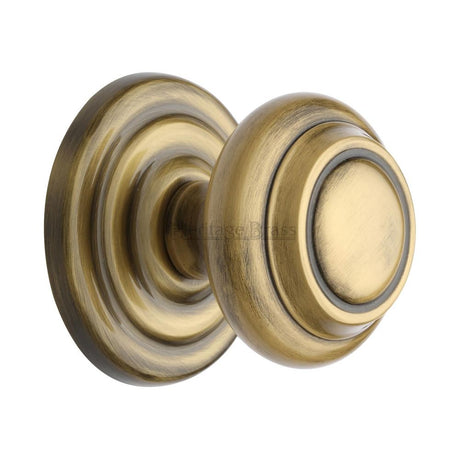 This is an image of a Heritage Brass - Centre Door Knob Round Design 3 1/2" Antique Brass Finish, v905-at that is available to order from Trade Door Handles in Kendal.