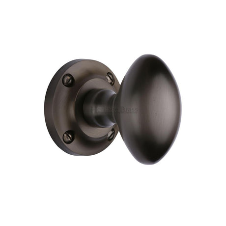 This is an image of a Heritage Brass - Mortice Knob on Rose Suffolk Design Matt Bronze Finish, v960-mb that is available to order from Trade Door Handles in Kendal.