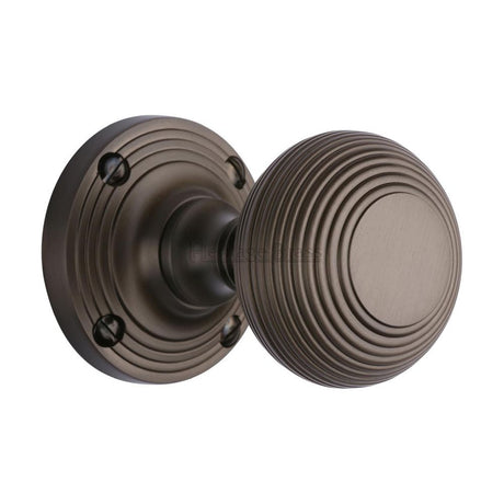 This is an image of a Heritage Brass - Mortice Knob on Rose Reeded Design Matt Bronze Finish, v971-mb that is available to order from Trade Door Handles in Kendal.
