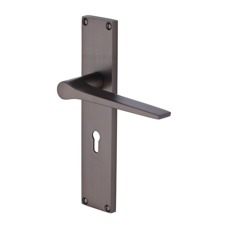 This is an image of a Heritage Brass - Gio Lever Lock Door Handle on 200mm Plate Matt Bronze finish, vt8100-mb that is available to order from Trade Door Handles in Kendal.
