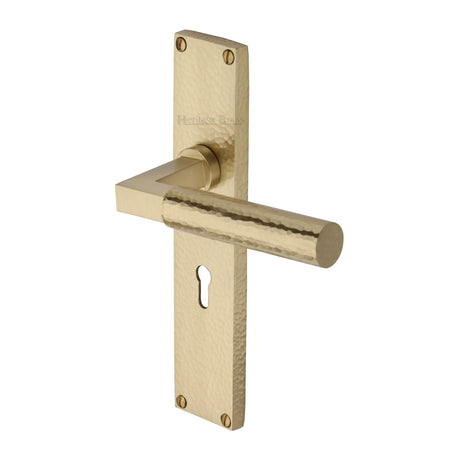 This is an image of a Heritage Brass - Bauhaus Hammered Lever Lock Door Handle on 200mm Plate Satin Brass finish, vth4300-sb that is available to order from Trade Door Handles in Kendal.