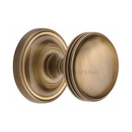 This is an image of a Heritage Brass - Mortice Knob on Rose Whitehall Design Antique Brass Finish, whi6429-at that is available to order from Trade Door Handles in Kendal.
