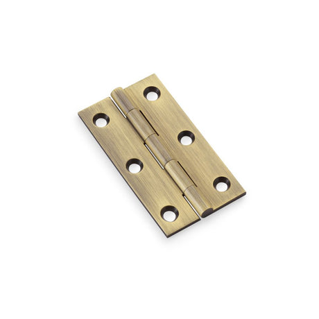 This is an image showing Alexander & Wilks Heavy Pattern Solid Brass Cabinet Butt Hinge - Antique Brass - 3" aw075-ch-ab available to order from Trade Door Handles in Kendal, quick delivery and discounted prices.