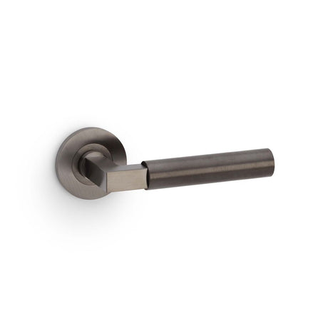 This is an image showing Alexander & Wilks Hurricane Plain Lever on Round Rose - Dark Bronze PVD aw201dbzpvd available to order from Trade Door Handles in Kendal, quick delivery and discounted prices.